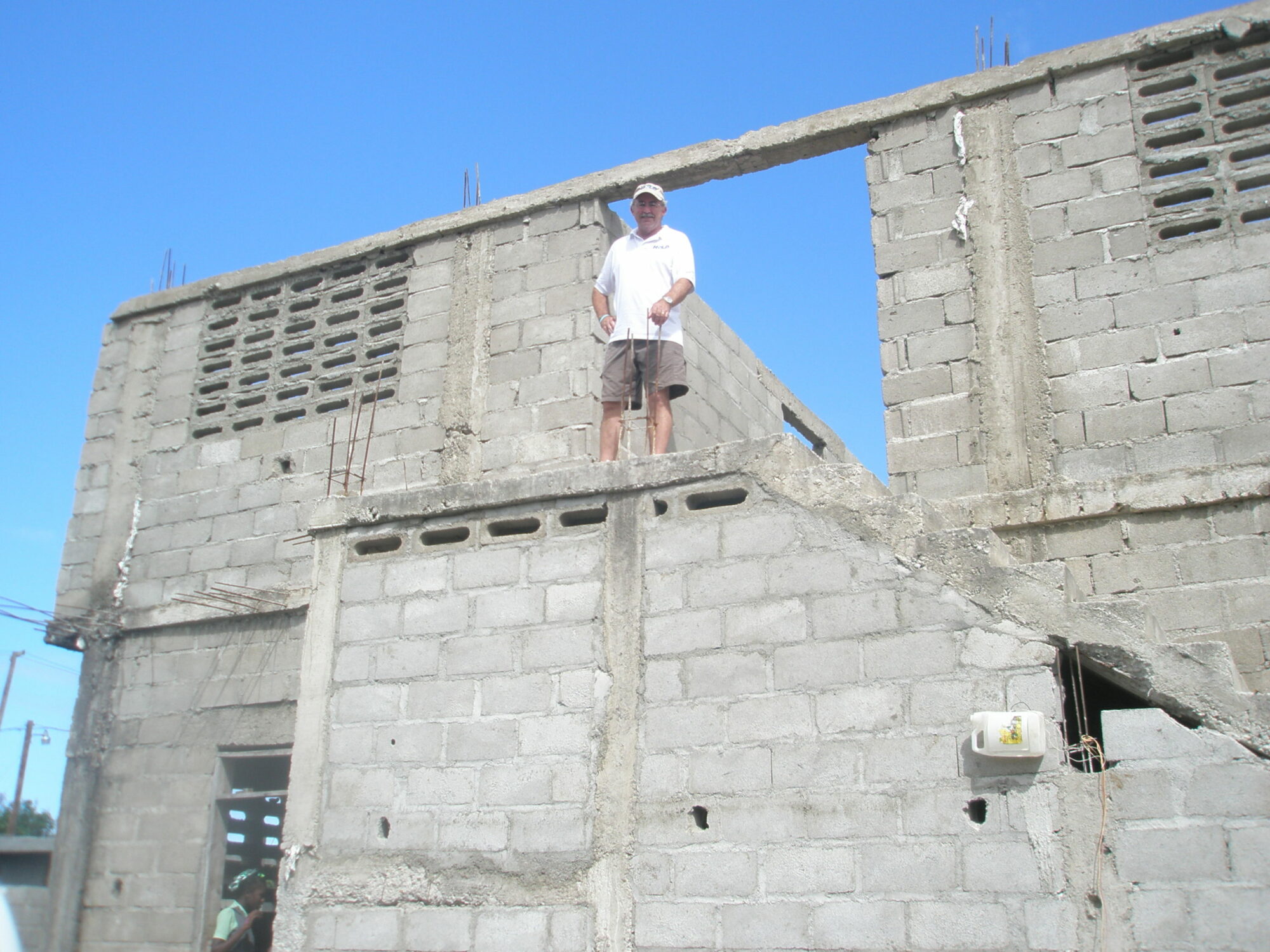Man in front of building being constructed