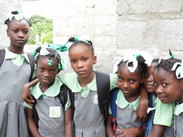 Six school children in uniforms
